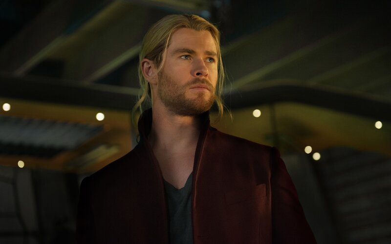 Man with Long Blonde Hair — Red, Serious