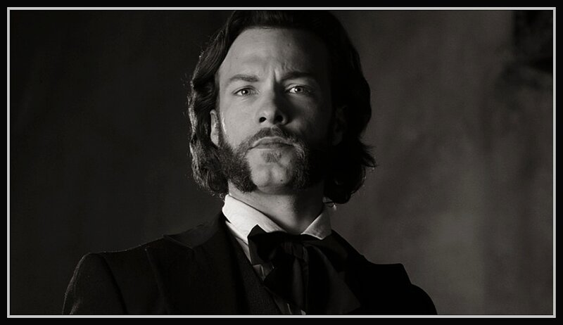Man with Long Hair and Beard — Black, Dramatic, Photograph, Suit