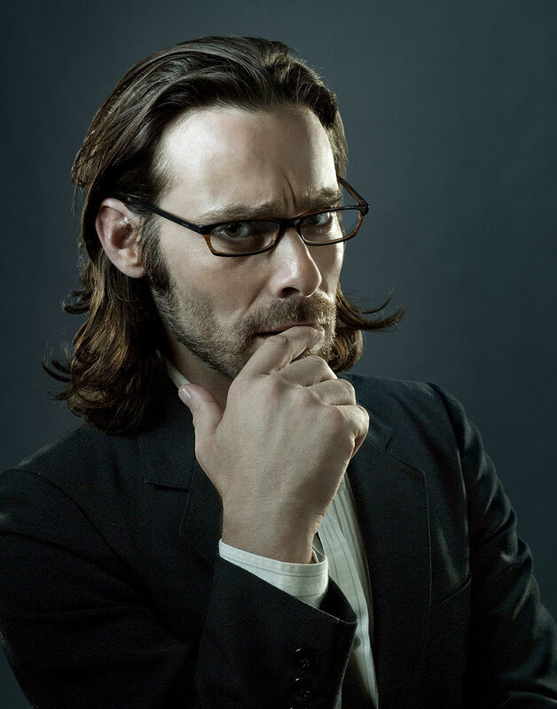 Man with Long Hair and Glasses — Black, Serious, Photograph