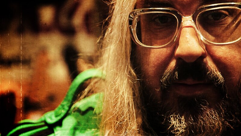 Man with Long Hair and Glasses — Brown