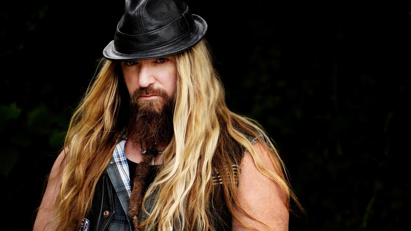 Man with Long Hair and Hat — Black, Serious