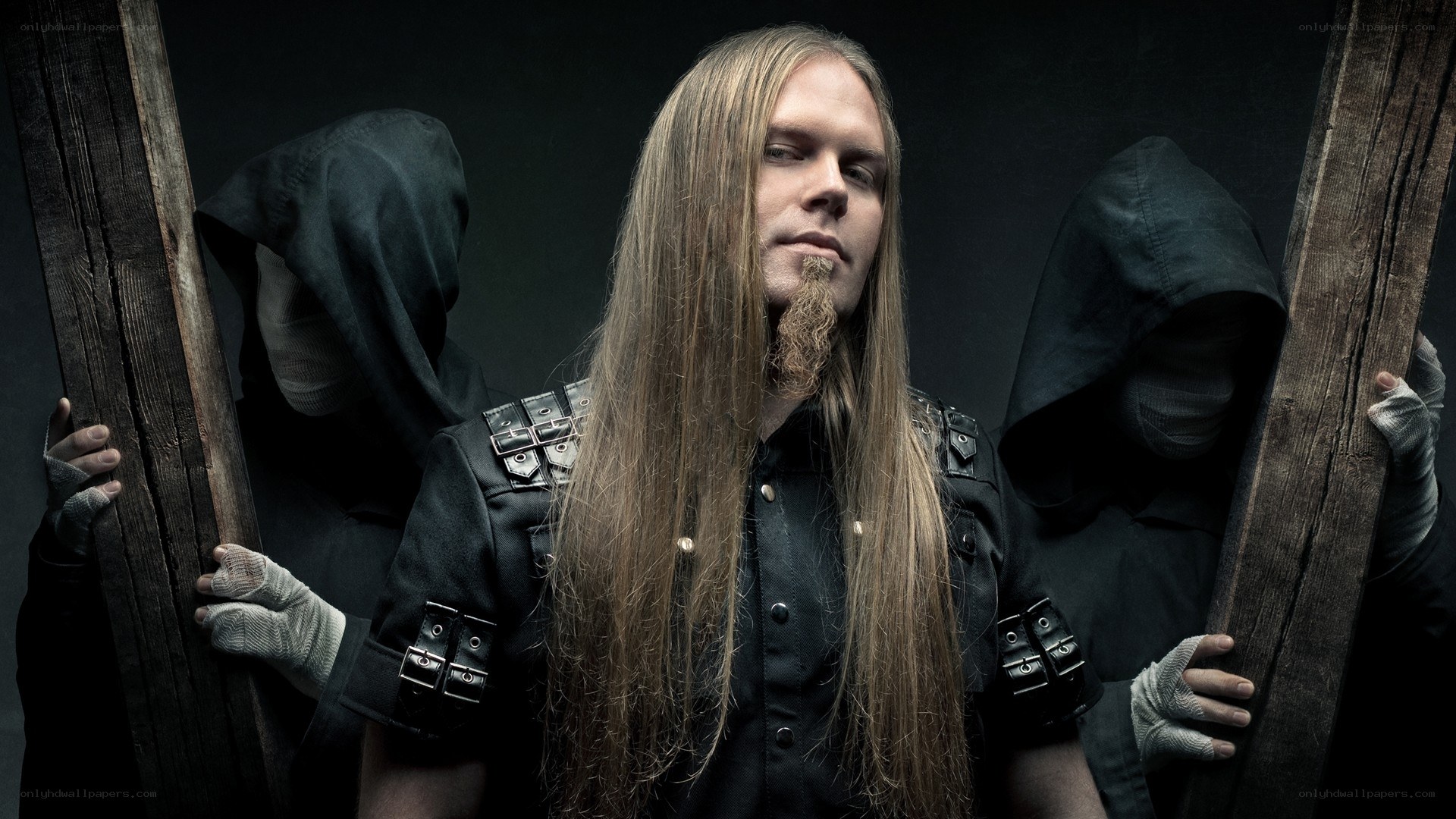 man with long hair and hooded figures