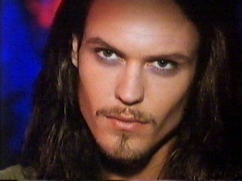 man with long hair and mustache
