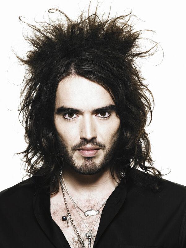 man with long hair and necklaces