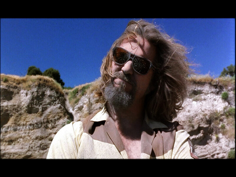 man with long hair and sunglasses