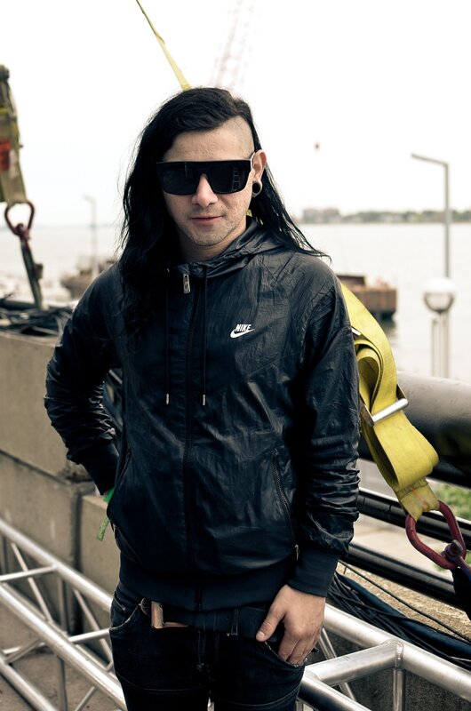 man with long hair and sunglasses