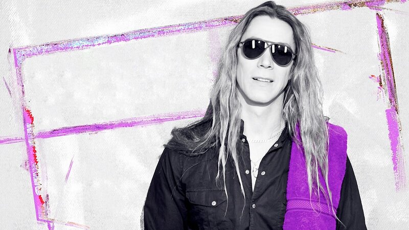 man with long hair and sunglasses
