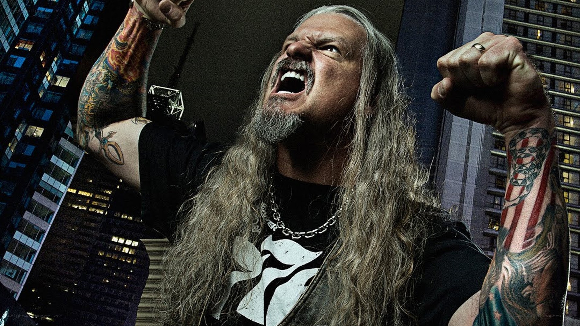 man with long hair and tattoos