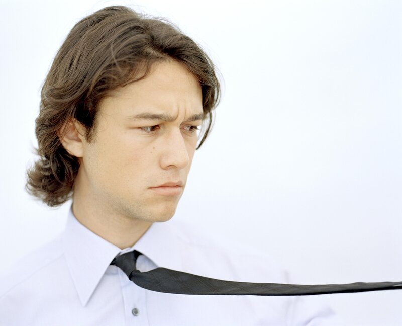 man with long hair and tie