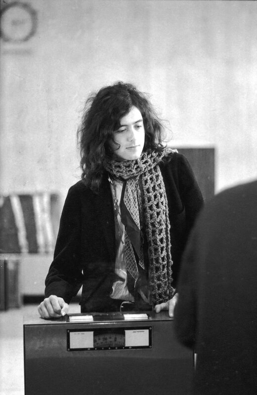 Man with long hair at a desk