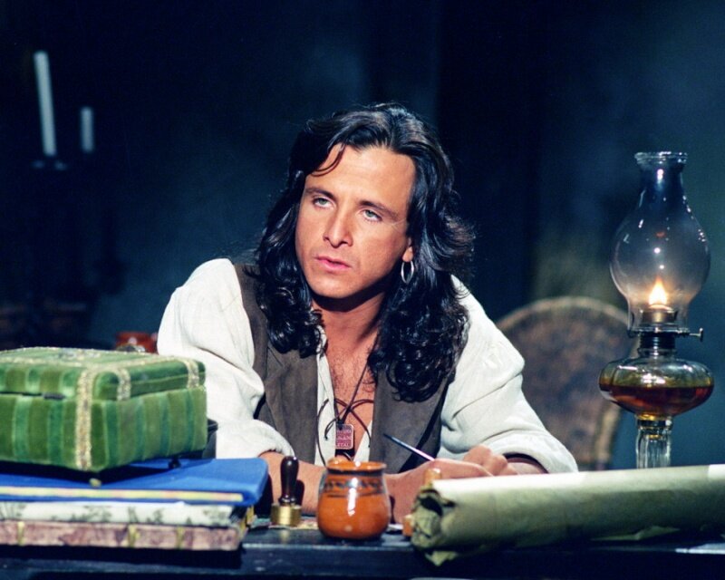 Man with Long Hair at Desk