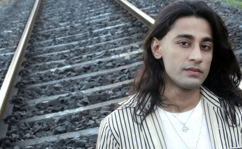 Man with Long Hair — Black, Neutral, Photograph, Railroad Tracks