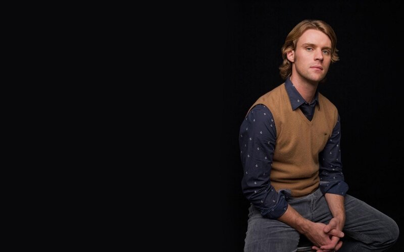 Man with Long Hair — Black, Serious, Photograph, Vest