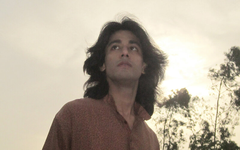 Man with Long Hair — Brown, Contemplative, Sunset