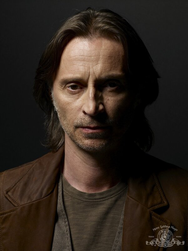 Man with Long Hair — Brown, Dramatic, Photograph, Brown Jacket