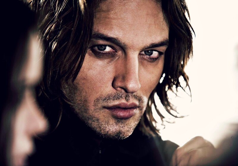 Man with Long Hair — Brown, Intense, Photograph