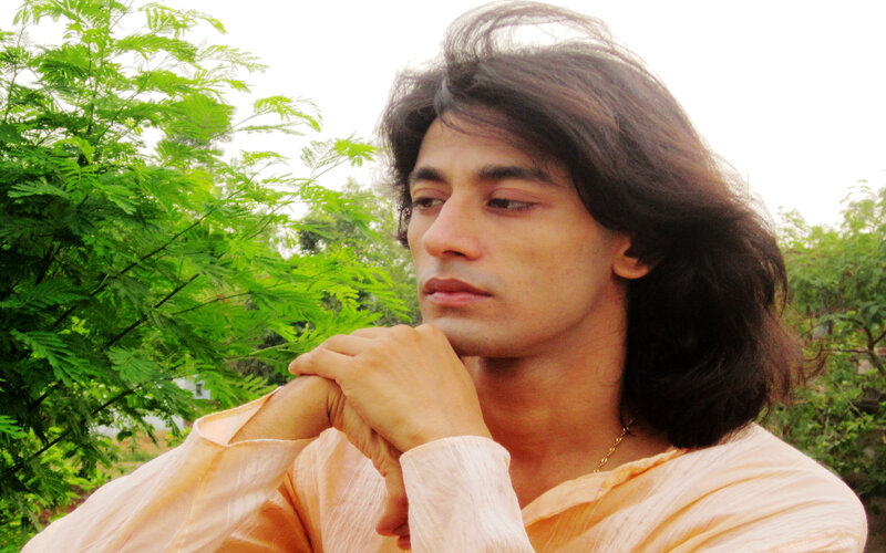 Man with Long Hair — Green, Contemplative, Afternoon, Photograph