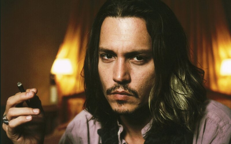 Man with Long Hair Holding Cigarette