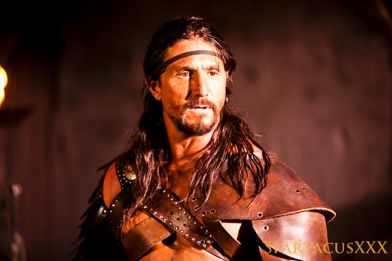 Man with Long Hair in Armor — Brown, Dramatic, Photograph