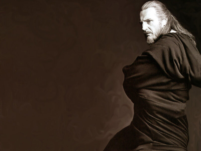 man with long hair in dark robe