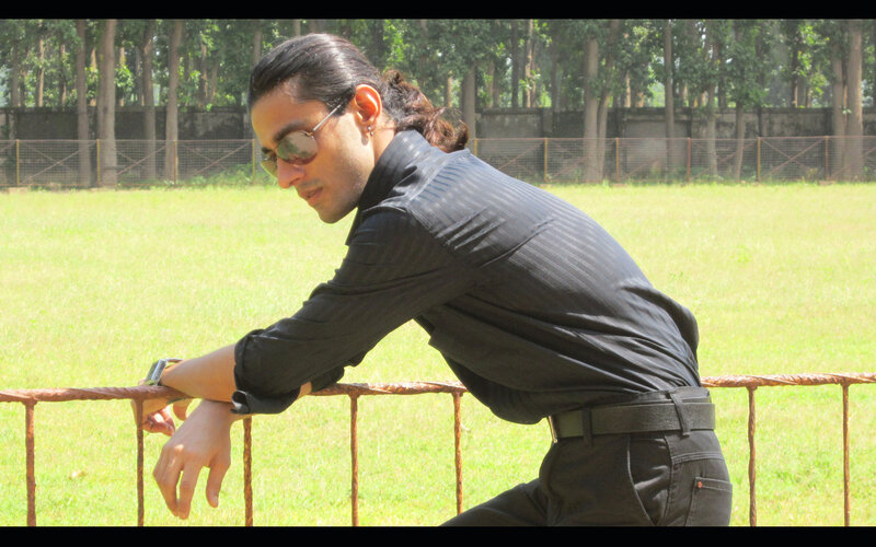 Man with Long Hair in Field
