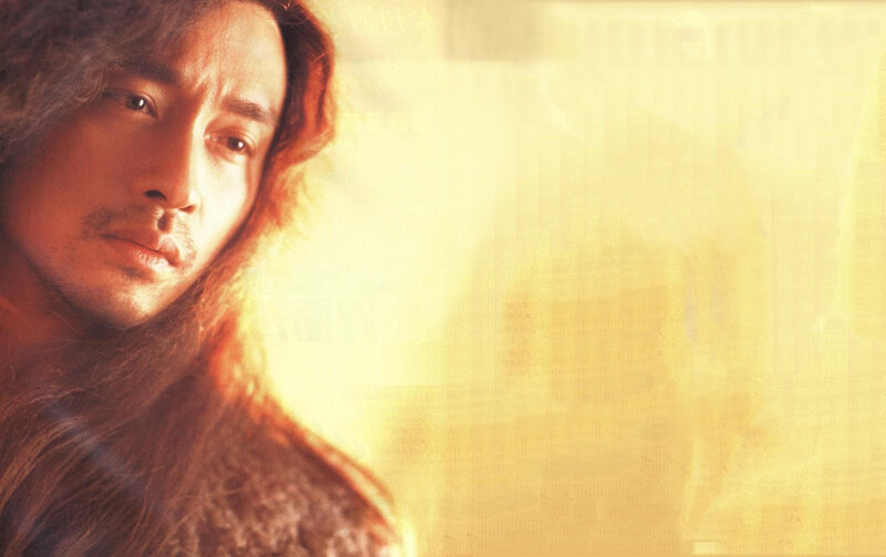 man with long hair in golden light