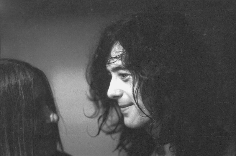 Man with long hair in profile
