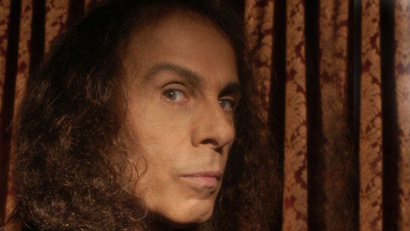 man with long hair in profile