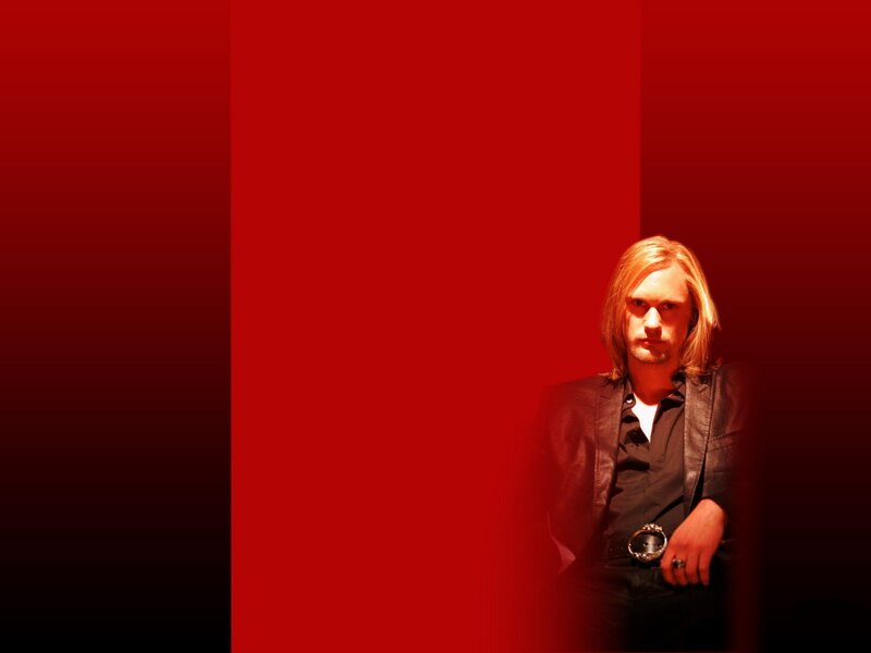man with long hair in red light