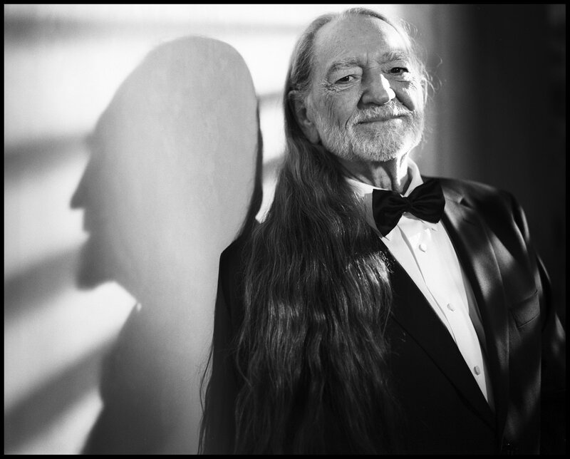 Man with long hair in tuxedo