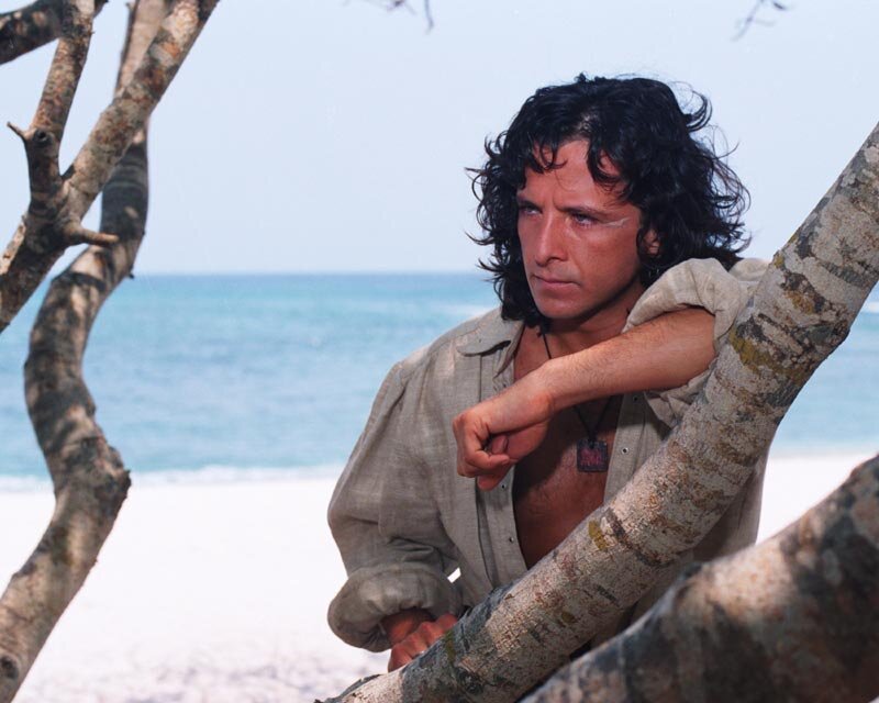 Man with Long Hair on Beach