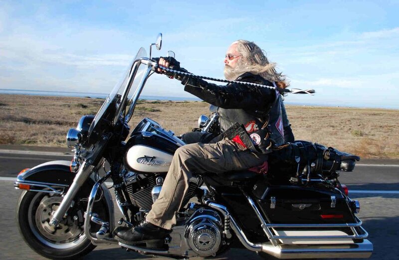 Man with Long Hair on Motorcycle