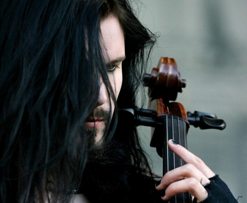 Man with Long Hair Playing Cello