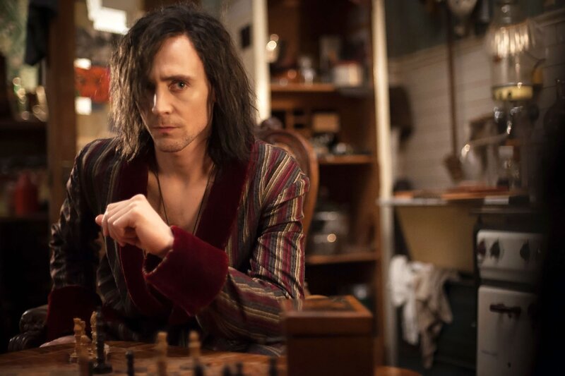Man with Long Hair Playing Chess