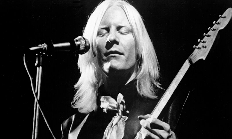 Man with Long Hair Playing Guitar — Black, Dramatic, Night