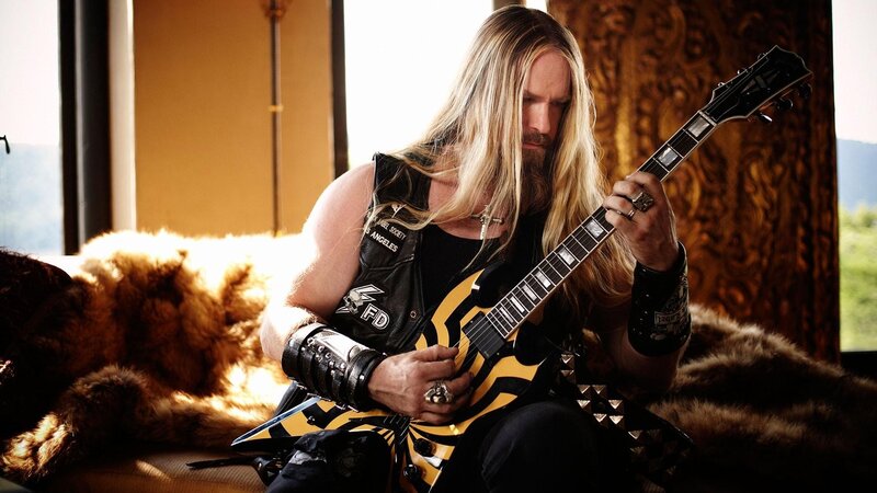 Man with Long Hair Playing Guitar — Black, Dramatic, Photograph