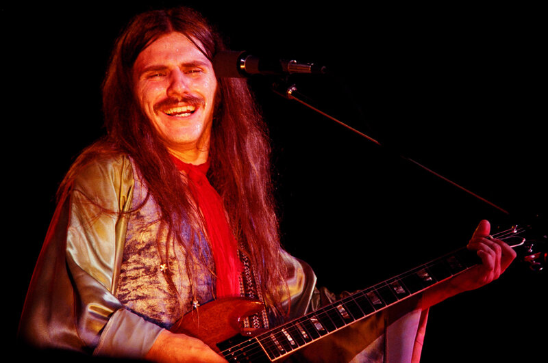Man with Long Hair Playing Guitar — Red