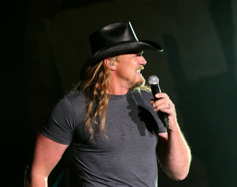 Man with Long Hair Singing — Black, Energetic, Photograph, Microphone, Cowboy Hat