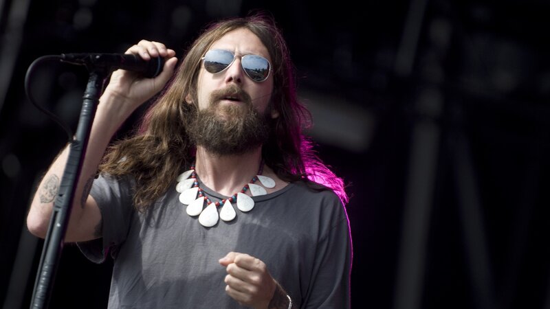 Man with Long Hair Singing — Black, Energetic