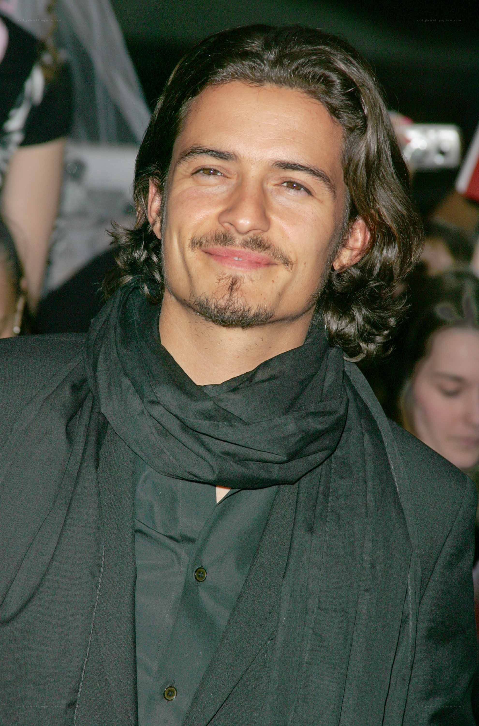 Man with long hair smiling