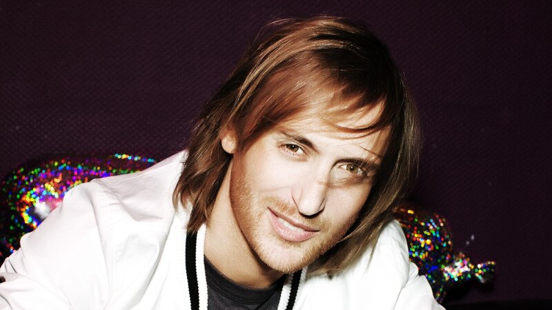 man with long hair smiling