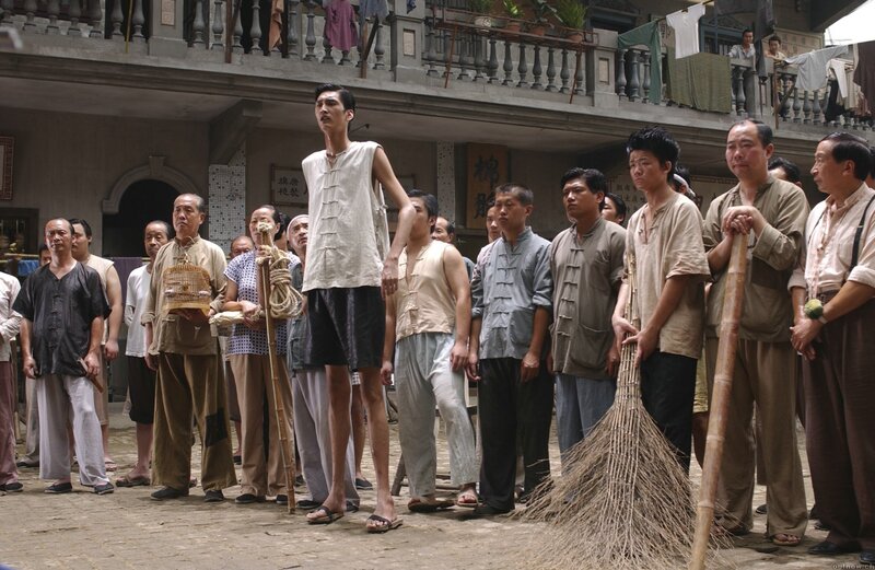 Man with Long Legs in Courtyard