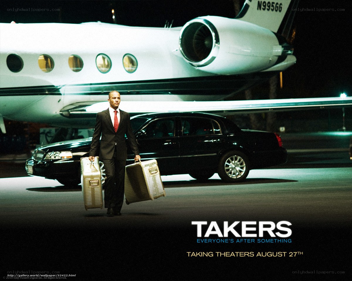 Man with luggage near private jet