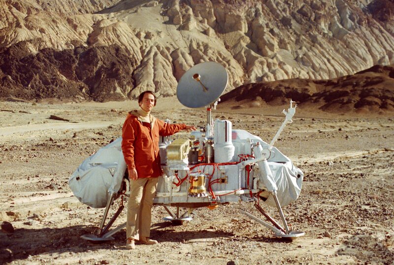 Man with Mars lander model
