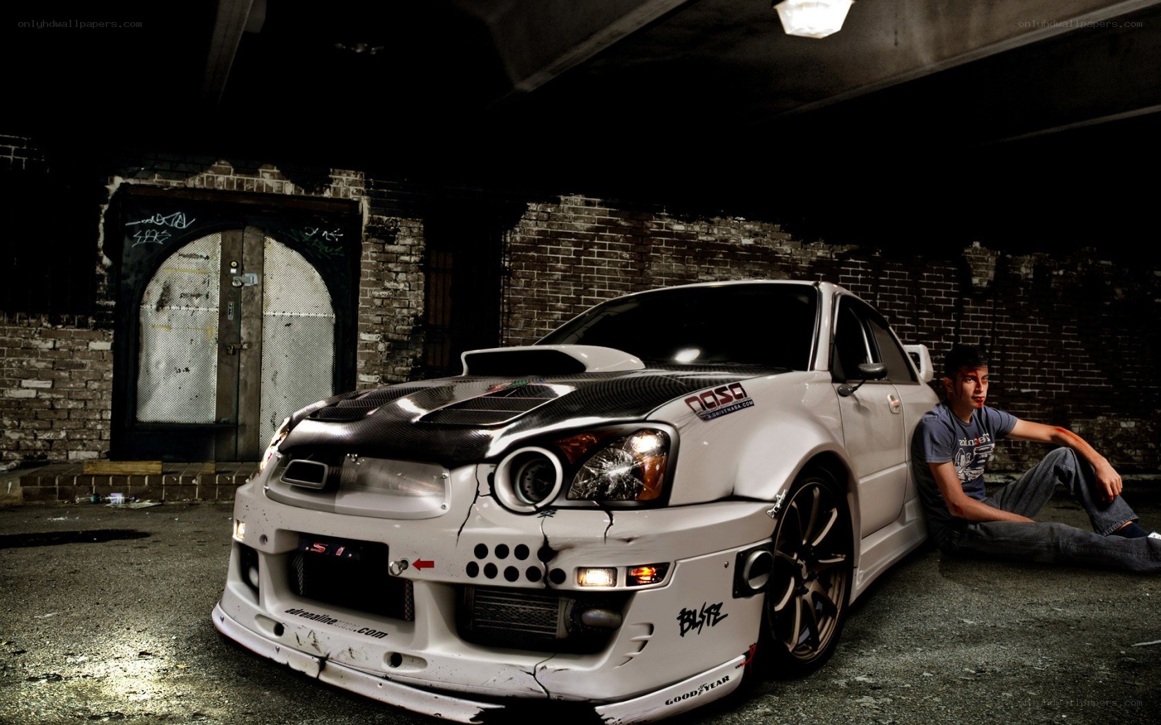 Man with modified car in garage