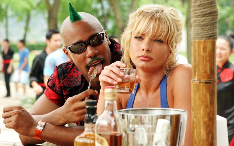 Man with mohawk and woman at bar