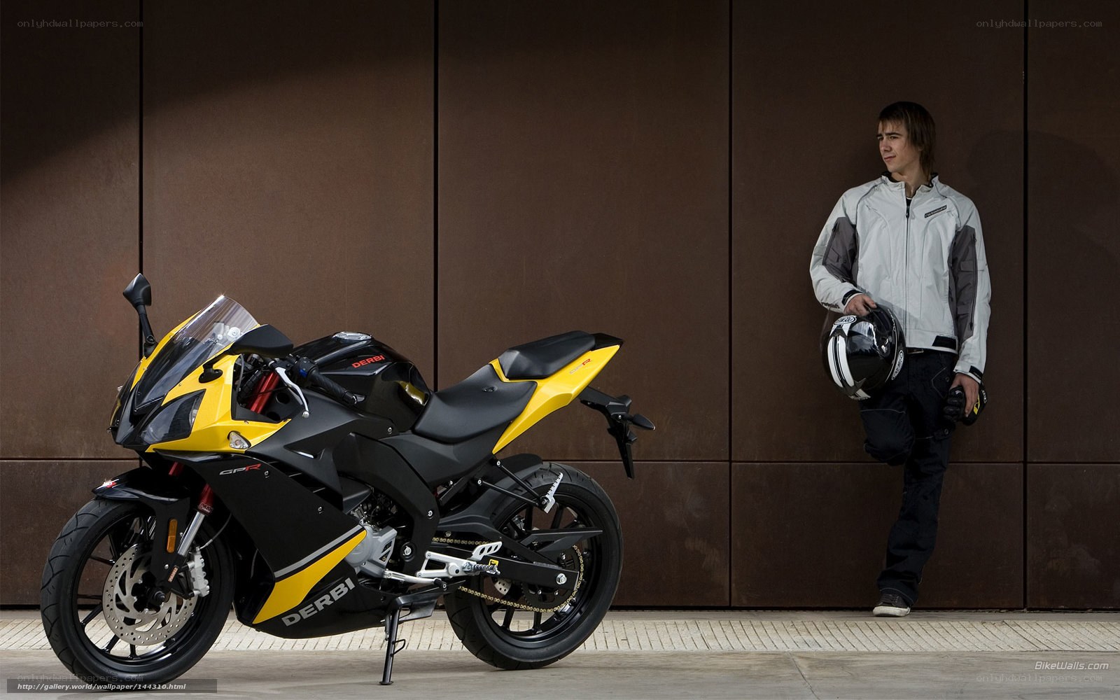 Man with motorcycle and helmet
