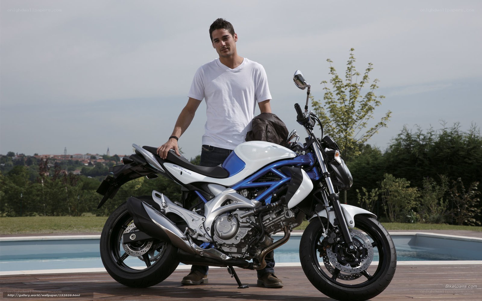 man with motorcycle by pool