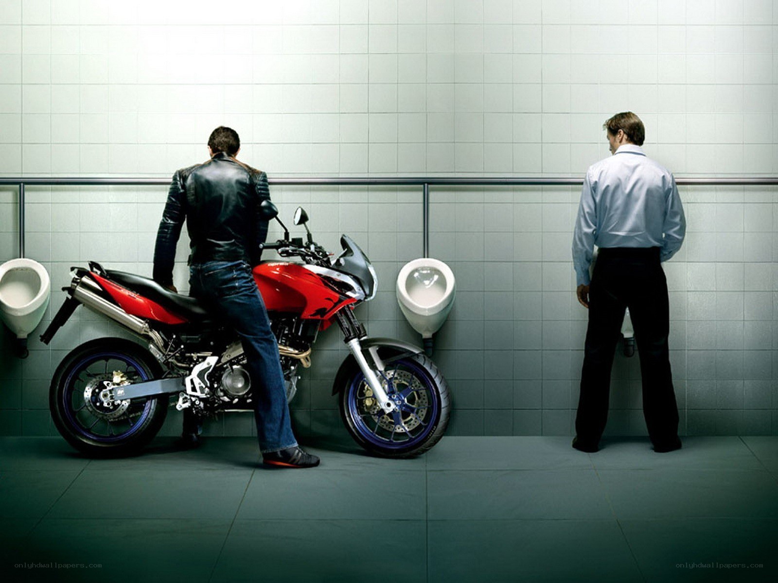 Man with motorcycle in restroom