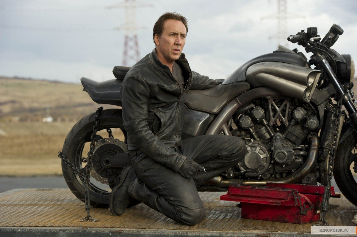 Man with motorcycle on trailer